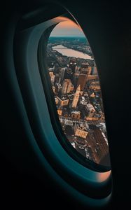 Превью обои иллюминатор, самолет, город, окно