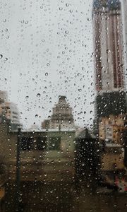 Превью обои капли, дождь, окно, город, стекло
