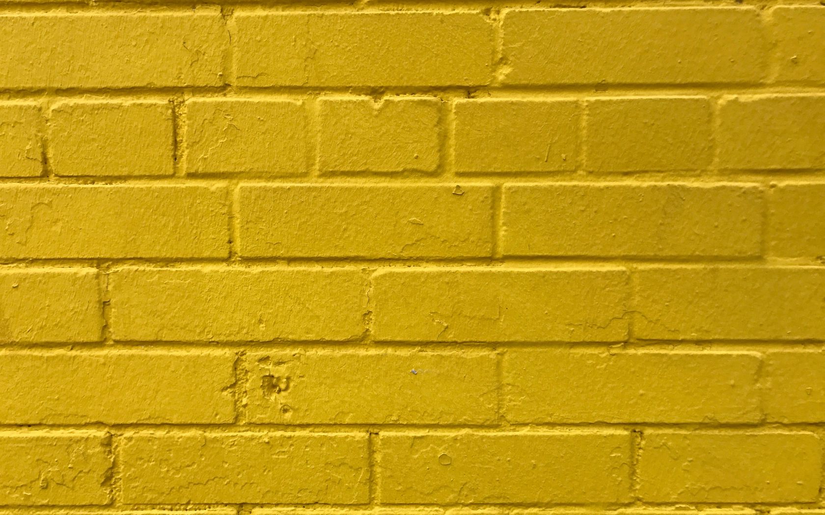 1680x1050 Обои кирпичи, желтый, стена, текстура