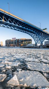 Превью обои лед, вода, трещины, мост, здание, зима