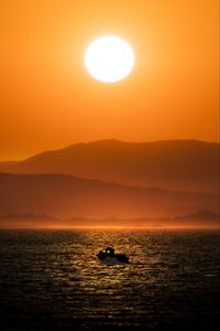 Превью обои лодка, море, холмы, силуэты, закат