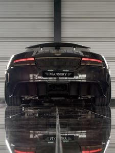 Превью обои mansory cyrus, 2009, черный, вид сзади, стиль, спорт, астон мартин, авто, отражение