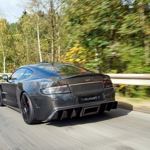 Превью обои mansory cyrus, 2009, черный, вид сзади, спорт, астон мартин, деревья, скорость