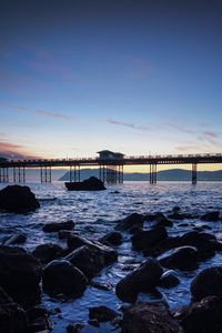 Превью обои мост, море, камни, сумерки