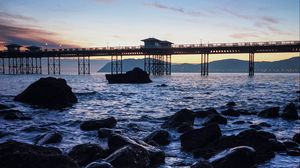 Превью обои мост, море, камни, сумерки
