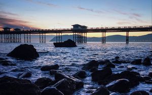 Превью обои мост, море, камни, сумерки