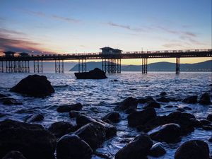Превью обои мост, море, камни, сумерки