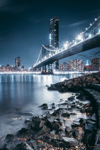 Превью обои мост, ночной город, берег, огни города, камни