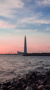 Превью обои небоскреб, побережье, море, сумерки