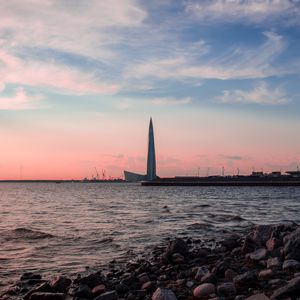 Превью обои небоскреб, побережье, море, сумерки