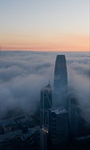 Превью обои небоскреб, здание, облака, туман, город