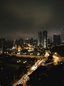 Превью обои небоскреб, здания, дорога, огни, город, ночь