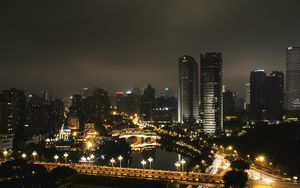 Превью обои небоскреб, здания, дорога, огни, город, ночь