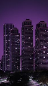 Превью обои небоскребы, здания, город, ночь, темный, фиолетовый