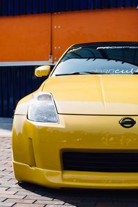 Превью обои nissan 350z, желтый, спорткар, вид спереди, тюнинг