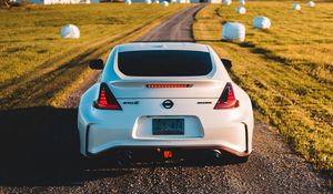 Превью обои nissan 370z, nissan, автомобиль, спорткар, вид сзади, дорога