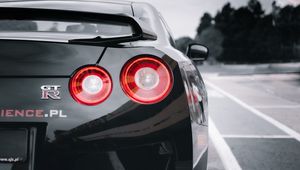 Превью обои nissan gtr, nissan, автомобиль, спорткар, черный, вид сзади