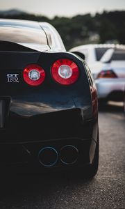 Превью обои nissan gt-r, nissan, автомобиль, спорткар, черный, вид сзади