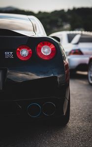 Превью обои nissan gt-r, nissan, автомобиль, спорткар, черный, вид сзади