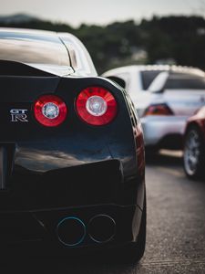 Превью обои nissan gt-r, nissan, автомобиль, спорткар, черный, вид сзади