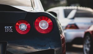 Превью обои nissan gt-r, nissan, автомобиль, спорткар, черный, вид сзади