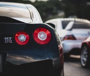 Превью обои nissan gt-r, nissan, автомобиль, спорткар, черный, вид сзади