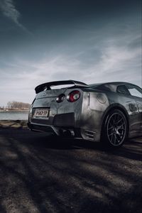 Превью обои nissan gt-r, nissan, автомобиль, серебряный, дорога, вид сбоку