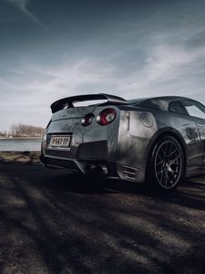 Превью обои nissan gt-r, nissan, автомобиль, серебряный, дорога, вид сбоку