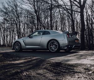 Превью обои nissan gt-r, nissan, автомобиль, серый, деревья, дорога