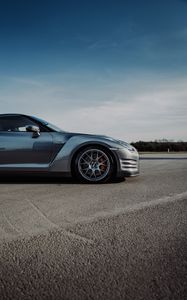 Превью обои nissan gt-r, nissan, автомобиль, серый, вид сбоку, асфальт