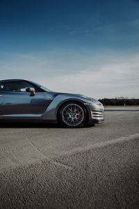Превью обои nissan gt-r, nissan, автомобиль, серый, вид сбоку, асфальт