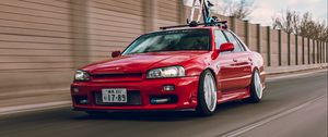 Превью обои nissan r34, nissan, автомобиль, красный, скорость, дорога