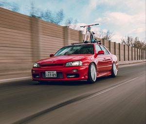 Превью обои nissan r34, nissan, автомобиль, красный, скорость, дорога