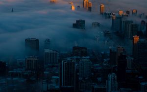 Превью обои ночной город, облака, вид сверху, туман, небоскребы