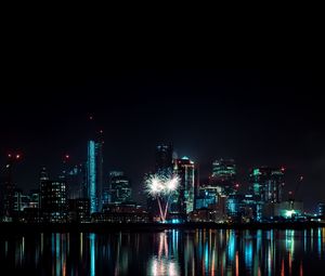 Превью обои ночной город, здания, фейерверк, вода, отражение