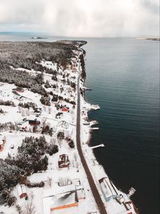 Превью обои остров, побережье, вид сверху, снег, здания