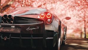 Превью обои pagani huayra, pagani, спорткар, суперкар, сакура, вид сзади