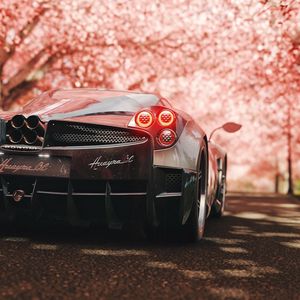 Превью обои pagani huayra, pagani, спорткар, суперкар, сакура, вид сзади