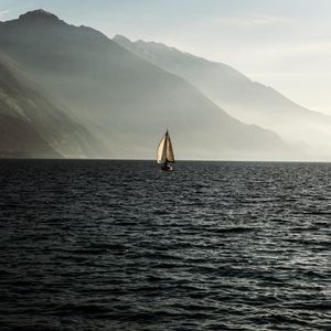 Превью обои парусник, море, горы, туман, волны