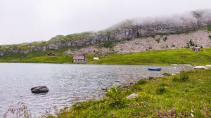 Превью обои пейзаж, озеро, дома, камень, берег, трава