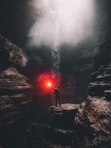 Превью обои пещера, человек, камни, свет