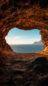 Превью обои пещера, скалы, камни, море, горизонт