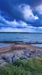 Превью обои пирс, море, облака, небо, камни