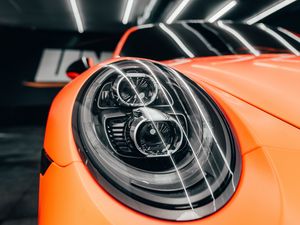 Превью обои porsche, автомобиль, оранжевый, фара, вид спереди