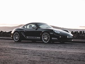 Превью обои porsche cayman 987 r, porsche, автомобиль, спорткар, черный, вид сбоку