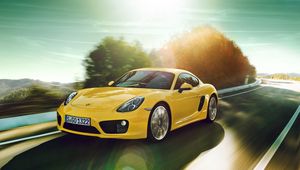 Превью обои porsche cayman, желтый, движение, дорога, поворот