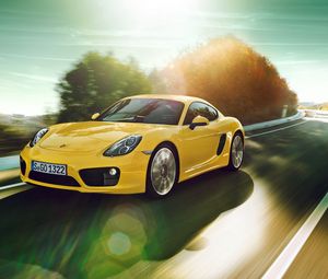 Превью обои porsche cayman, желтый, движение, дорога, поворот