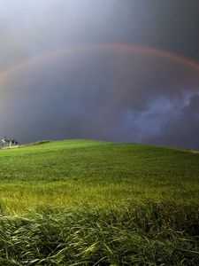 Превью обои радуга, тучи, холм, пасмурно, луг