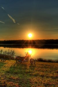 Превью обои река, мотоцикл, закат, трава