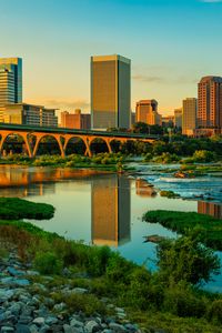 Превью обои река, зелень, мост, здания, город, закат